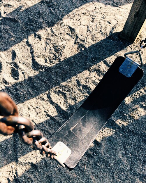 A close-up shot of a rugged phone case being dropped from a height of about 1 meter onto a concrete floor, demonstrating its impact resistance.