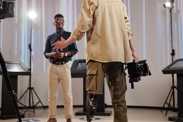 A behind-the-scenes shot of a Nollywood film set, featuring a director giving instructions to the cast and crew. The set is a bustling environment with various equipment, capturing the collaborative effort involved in making a movie. The lighting and composition emphasize the professionalism and dedication of the team.
